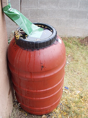 Rain Barrel overflowing with rain water Rain Barrel overflowing with rain water